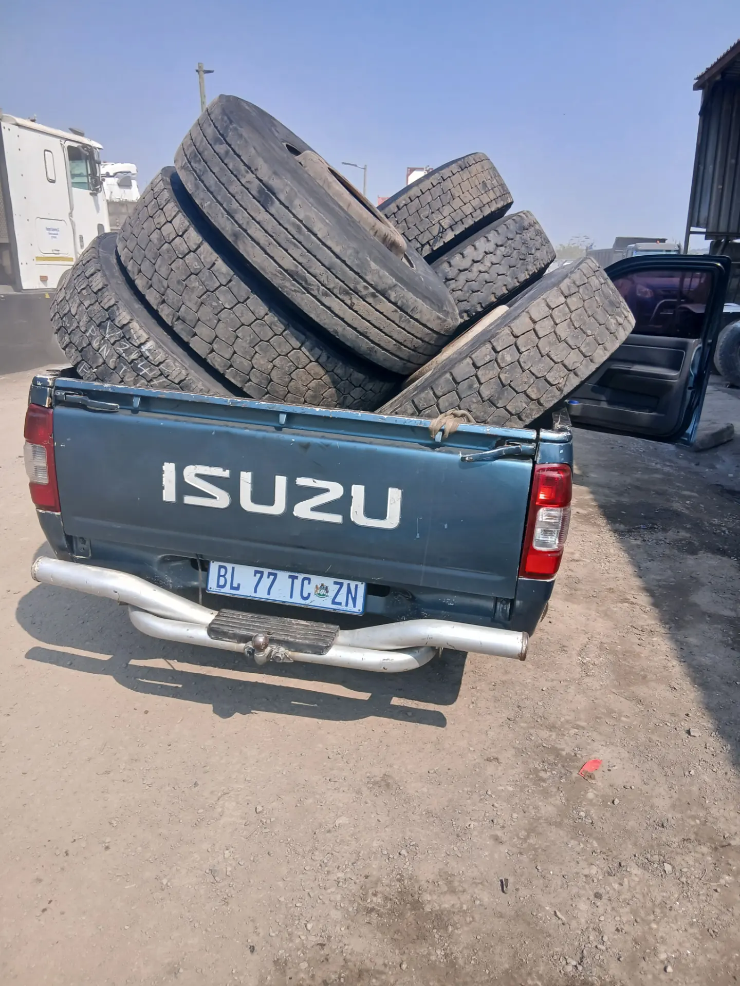 Truck tyres being transported from the tyre yard